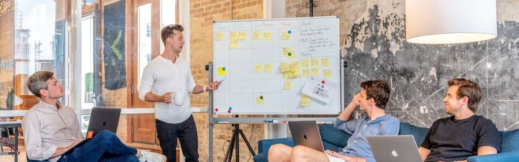 Team collaborating on planning and strategy in a bright modern office workspace